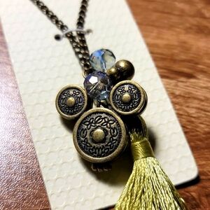 New DISNEY PARKS Green Tassle Locket Necklace